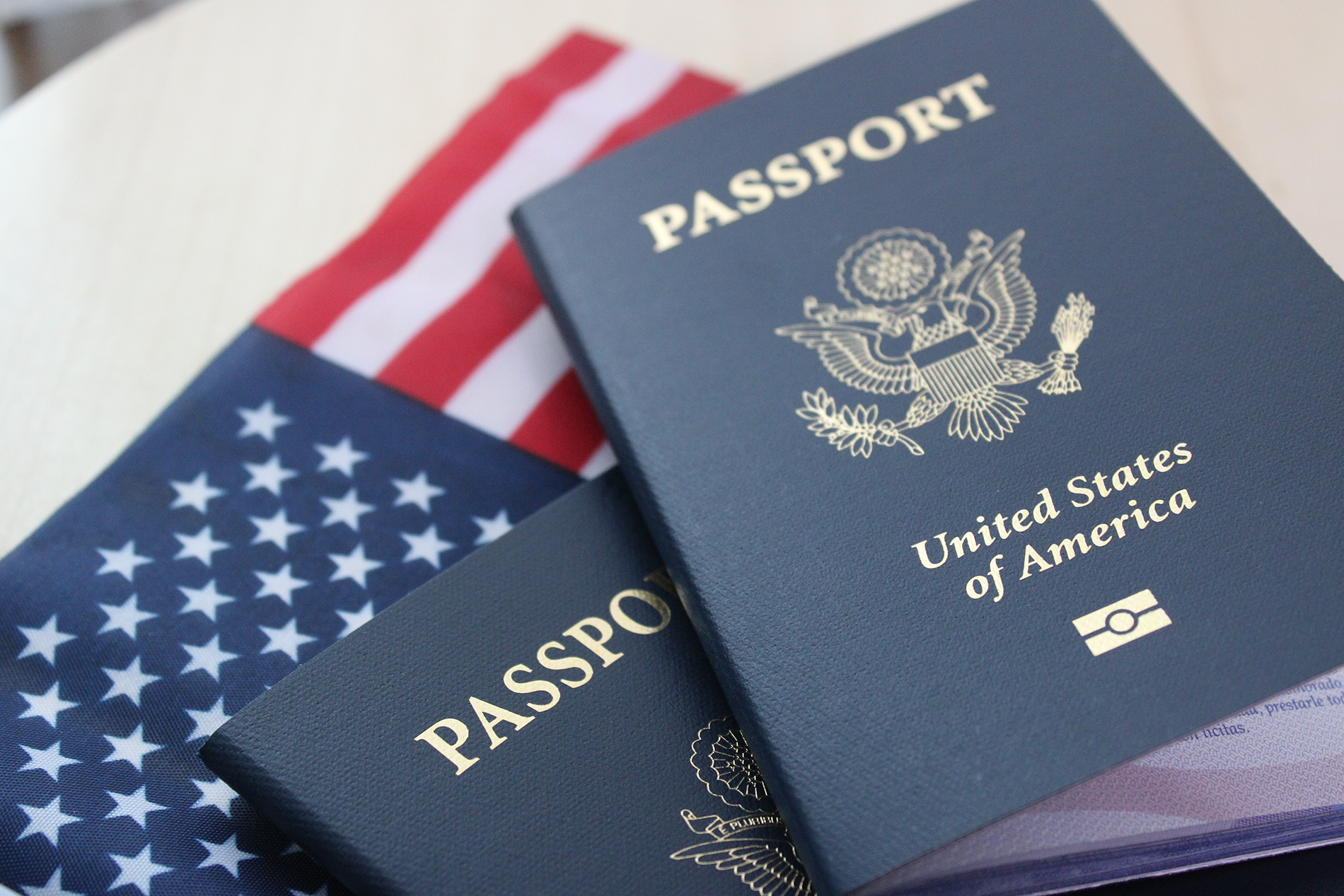 Image of a passport and American flag, signifying citizenship and legal assistance of Immigration Lawyer in Clark New Jersey