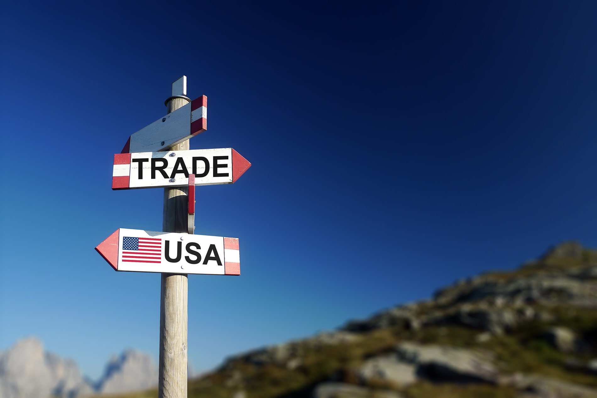 A signpost featuring "Trade" and "USA," representing the connection between the two in the context of NAFTA