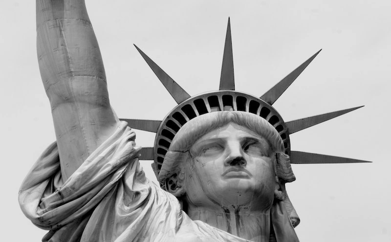 Statue with head and raised arm, illustrating updates from the Visa Bulletin